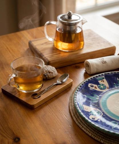 a cup of tea and a tea pot on a table at B&B Zia Bianca in Vietri sul Mare