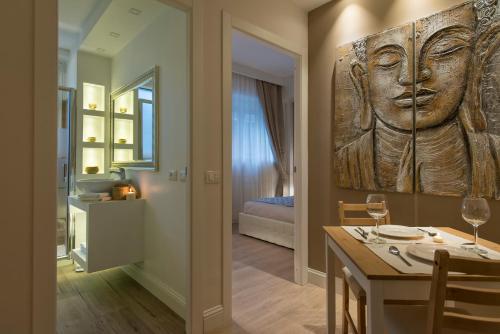 a dining room with a carving of a face on the wall at Aruna Suites in Rome