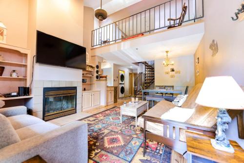 a living room with a couch and a fireplace at Pine Acres 109 - Hideaway in Durango