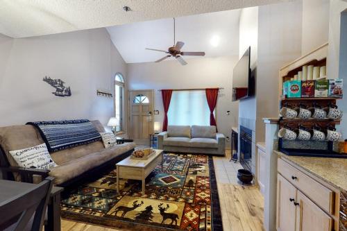 a living room with a couch and a table at Pine Acres 109 - Hideaway in Durango
