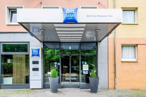 a store front with a sign for a bus garage at Ibis budget Berlin Potsdamer Platz in Berlin