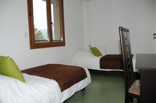 En eller flere senge i et værelse på Residence Adrechas et Spa