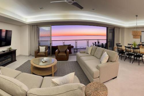 a living room with a couch and a table at NEW Sonoran Star Luxury condo 2BD, 2BA in Puerto Peñasco