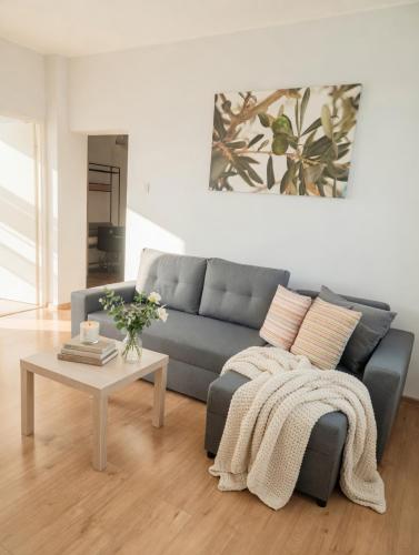 a living room with a couch and a coffee table at DalkoskaStreet in Gniezno