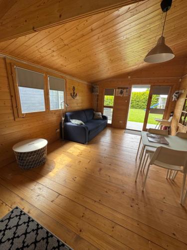 a living room with a couch and a table at Przystanek Wyspa in Gdańsk