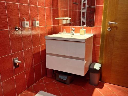 a bathroom with a sink and a mirror at Kuca Kosta in Pale