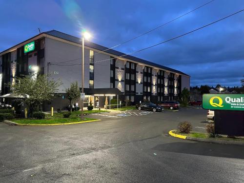 an empty parking lot in front of a hotel at Quality Inn & Suites Everett in Everett