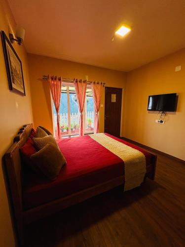 a bedroom with a large bed with a window at Rosewood Camellia - Near Ooty Town in Ooty