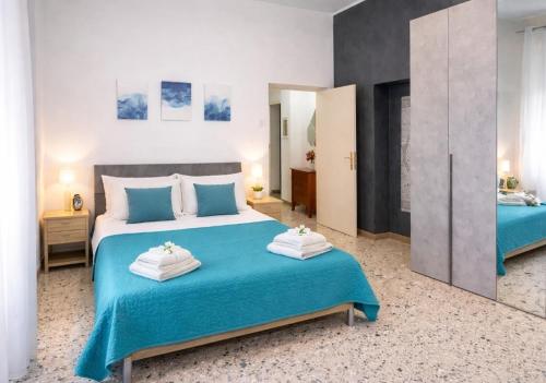 a bedroom with two beds and a mirror at Sweet Holidays al centro di Formia in Formia