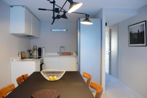 a kitchen with a table with a bowl on it at Home by U - Chalet 5 in Saint-Martin-de-Belleville