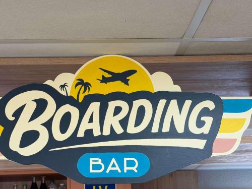 a sign for a bar with an airplane on it at ibis budget Marseille Aeroport Provence in Marignane