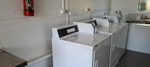 a laboratory with three machines in a kitchen at Rivergums Caravan Park in Goondiwindi