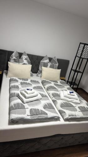 a bed with two towels on top of it at Cozy apartment in Sankt Goar