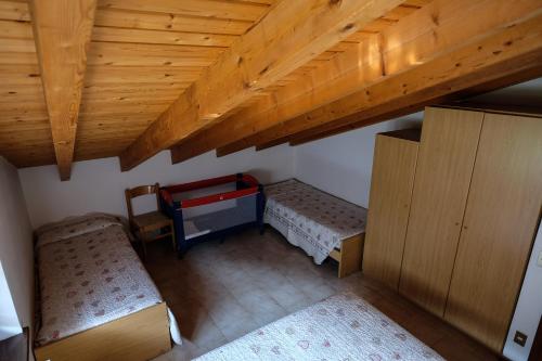 Letto o letti in una camera di Casa Pineta