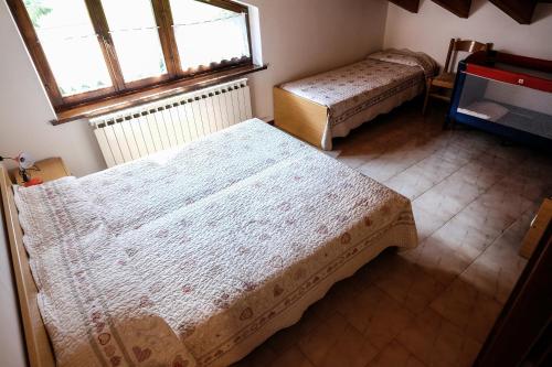 Letto o letti in una camera di Casa Pineta