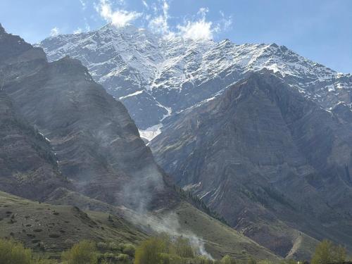 a mountain with snow on top of it at Hotel Devachan & Restaurant in Tāndi