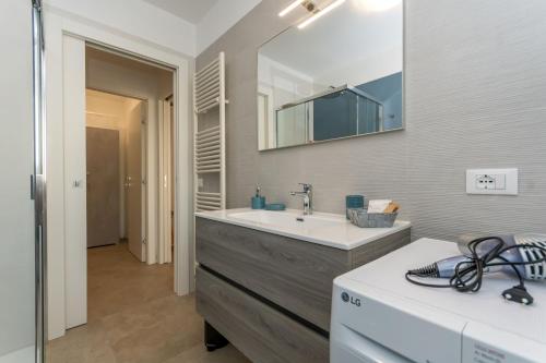 a bathroom with a sink and a mirror at Al Col de Foia in Agordo