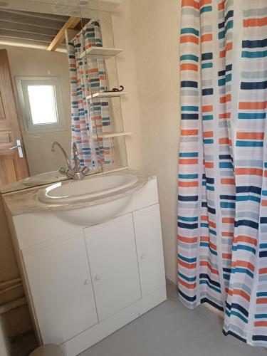 a bathroom with a sink and a mirror at Yachting lodge 83 in Sanary-sur-Mer