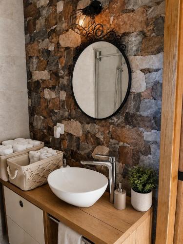 a bathroom with a sink and a mirror at Relax house Aurora in Jasenovica