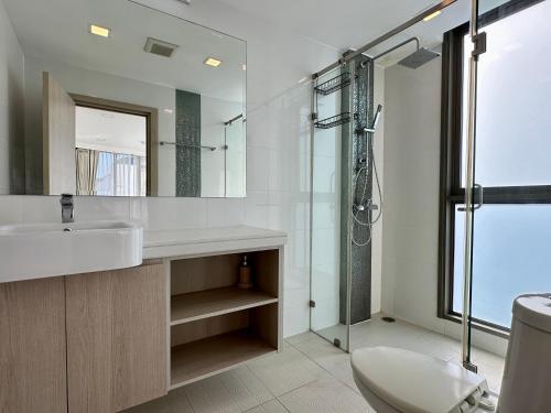 a bathroom with a sink and a shower at DOR ApartHotel in Chişinău