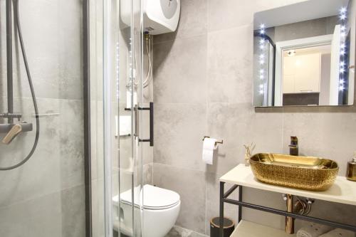 a bathroom with a sink and a toilet and a mirror at Casa del Sole - Ugljan Island in Poljana