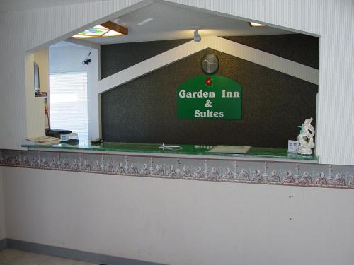 a sign for a garden inn and suites on a wall at Garden Inn & Suites in Rockmart