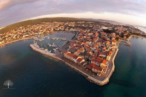 an aerial view of a small island in the water at Apartments Mira in Bibinje