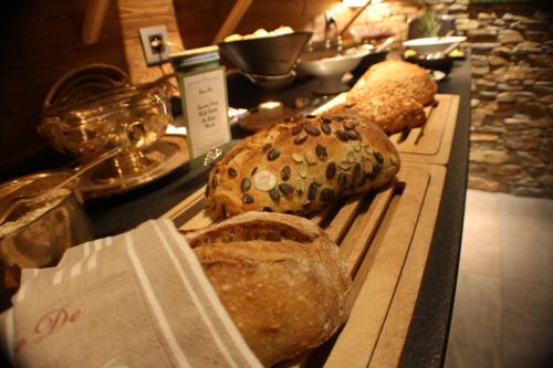 two loaves of bread sitting on a table at Chalet-Hôtel Hermitage in Chamonix-Mont-Blanc