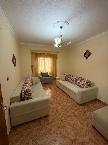 a living room with two couches and a couch at Cozy Pogradec in Pogradec