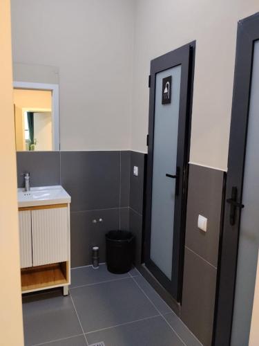 a bathroom with a sink and a mirror at Hostel 78 in Karakol