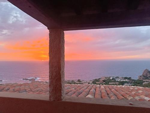a view of the ocean from a building window at Una terrazza in Paradiso in Costa Paradiso