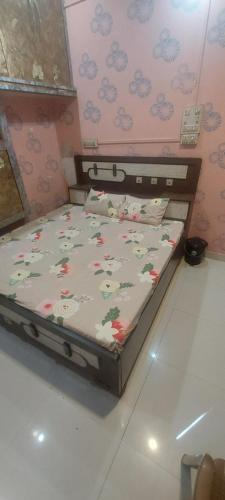 a bed sitting in a room with at Hotel KANHA in Karauli