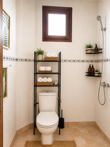 a bathroom with a toilet and a shower at Riad Boya Surf - Lodge in Agadir