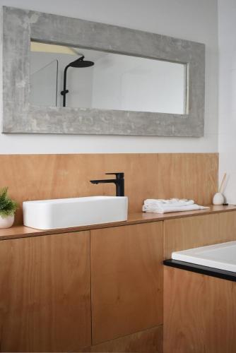 a bathroom with a sink and a mirror at Little Banks in Robe