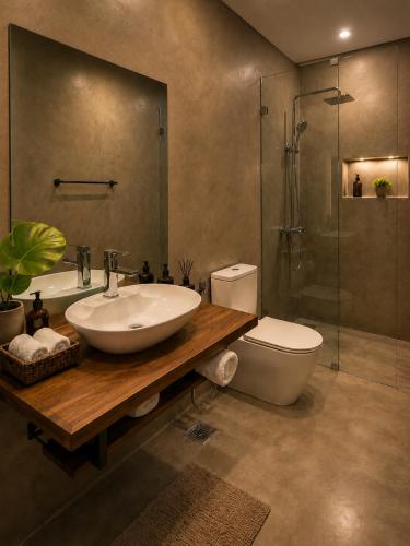 a bathroom with a sink and a toilet and a shower at Myla Lodge in Anuradhapura