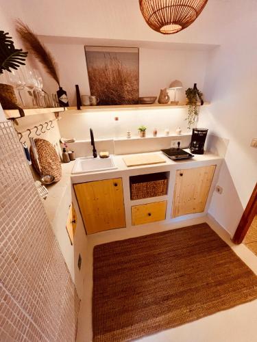 a kitchen with a sink and a counter top at Casa Milano Krk in Njivice