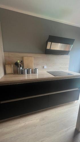 a kitchen with a sink and a counter top at Jugendgästehaus Lichterfelde JuLi in Berlin