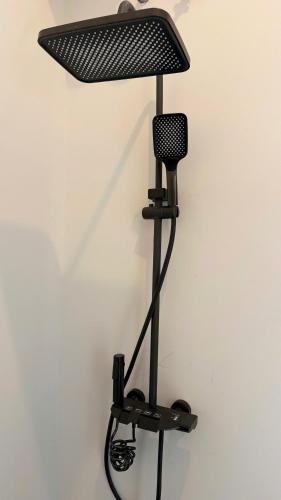 a microphone on a stand next to a wall at Resort Hoa Loi in Vĩnh Cửu Lỏi (1)
