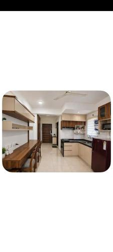 a large kitchen with a wooden table and benches at Studio apartment in Siroli
