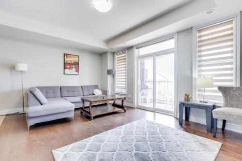 a living room with a couch and a table at Spacious Bright Private! Townhome in Markham in Markham