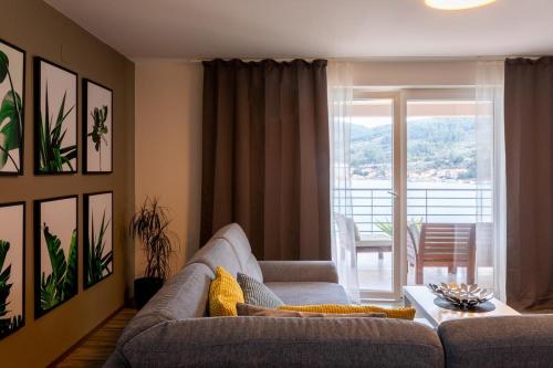 a living room with a couch and a table at Beachfront villa with private pool in Vela Luka in Vela Luka