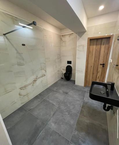 a bathroom with a sink and a toilet at Apartmán Natalka7 in Bartovice
