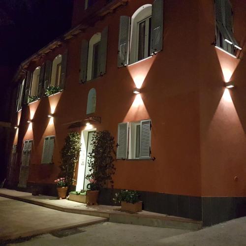 a building with lights on the side of it at night at Villa Mont des Oliviers CITRA-8055LT-1805 e 1807 in Sanremo