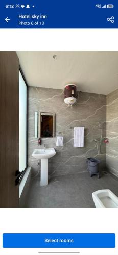 a bathroom with a sink and a toilet in it at Hotel sky inn in Jalandhar
