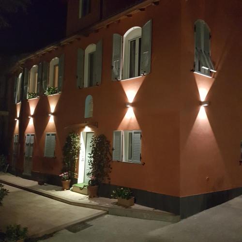 a building with lights on the side of it at night at Villa Mont des Oliviers CITRA-8055LT-1805 e 1807 in Sanremo