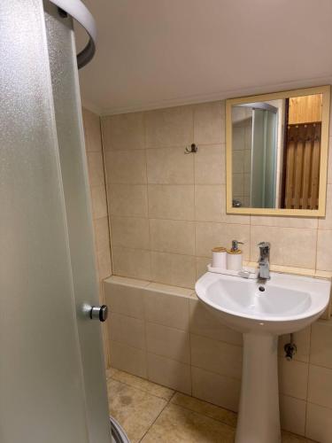 a bathroom with a sink and a mirror at Cube in Kvasy