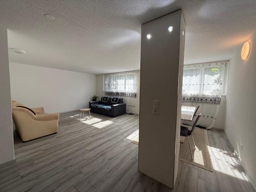 a living room with a couch and a table at AIRR Wohnung in Flumenthal in Flumenthal