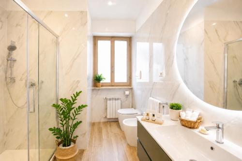 a bathroom with a shower and a toilet and a sink at You and the Sea in Savona