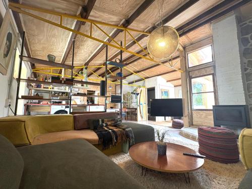a living room with a couch and a table at Casacresta in Carabaño