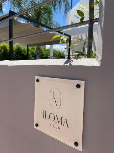 a sign that reads luna villa on a wall at Iloma Villa 6 km from Nafplio in Dhalamanára
